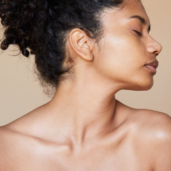 A woman's face and neck after being cleansed by a gentle face cleanser: Agave Ferment + Fruit Extract Face Cleanser.